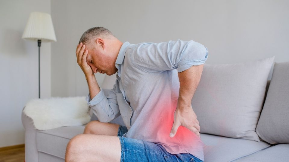 A man in pain who needs chronic pain management near me.